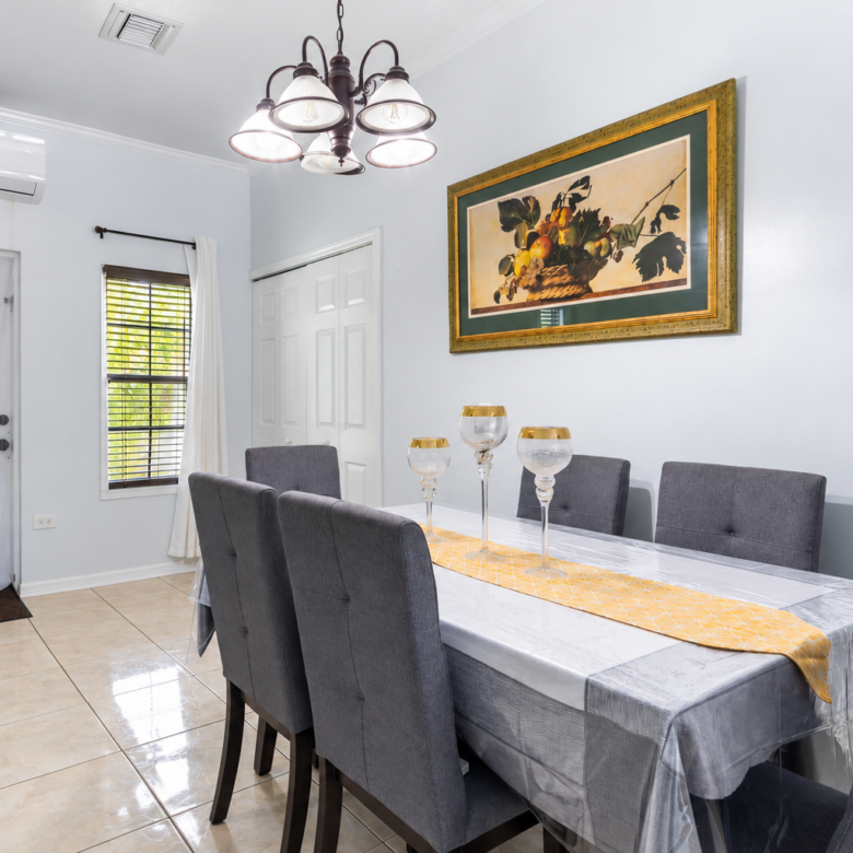 20261013114928 Bright Modern Dining Room with GoldFramed Art