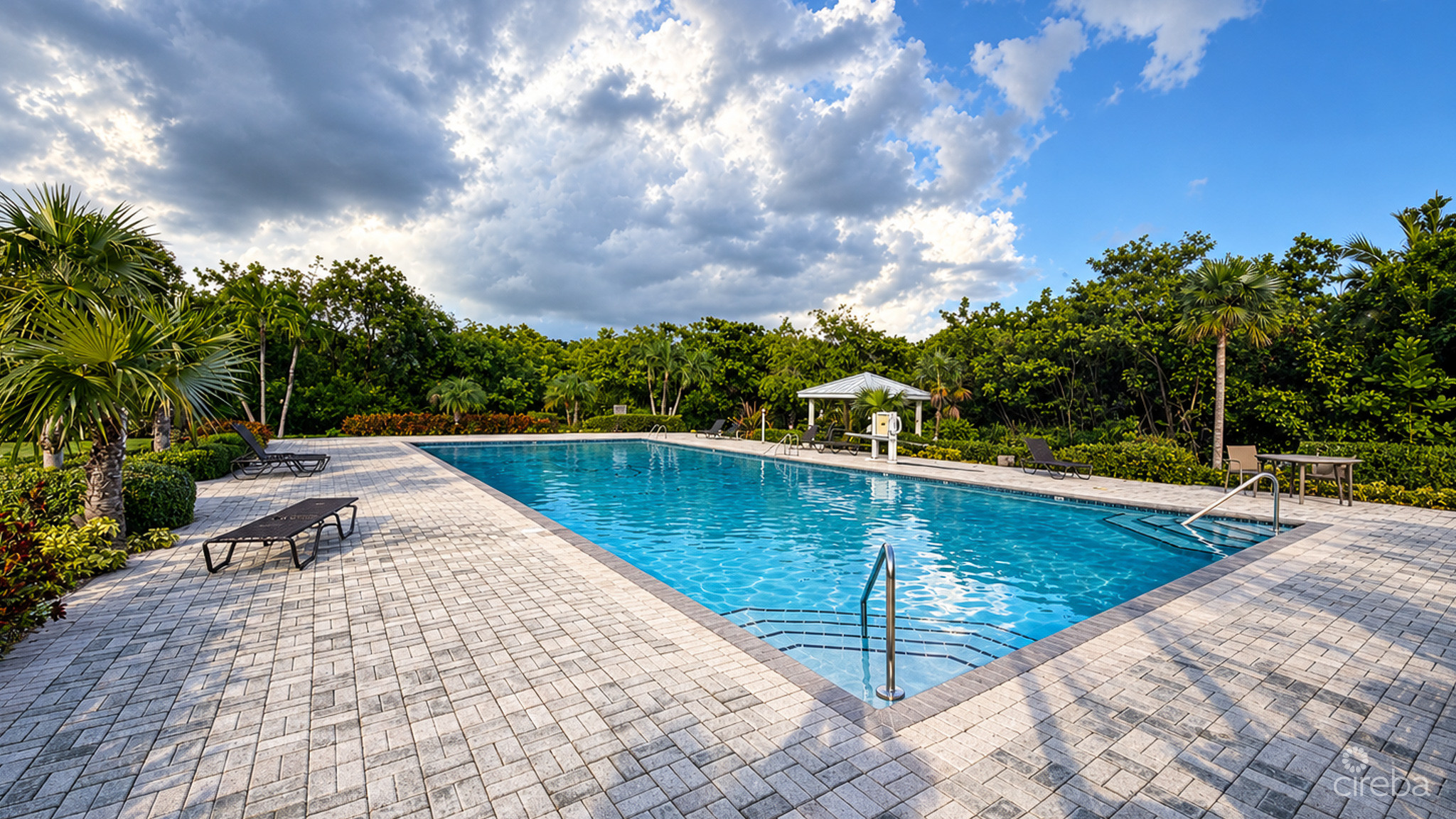 20261021132544 Tropical Pool Retreat Under Dramatic Skies